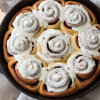 Pan of homemade cinnamon rolls with cream cheese frosting