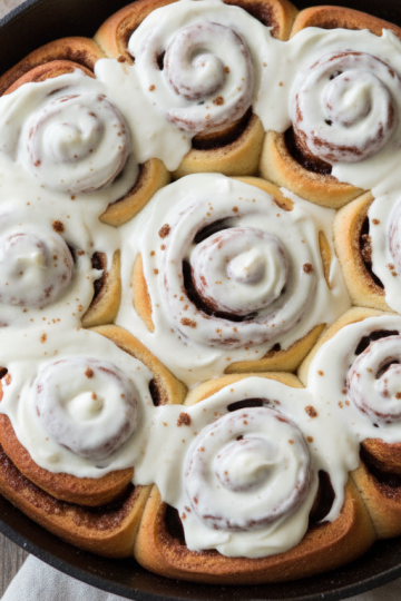 Pan of homemade cinnamon rolls with cream cheese frosting