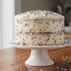 Funfetti cake from scratch on a white cake stand